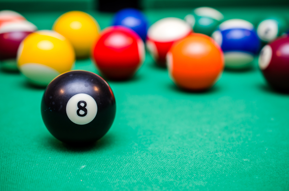 8 Ball from pool or billiards on a billiard table