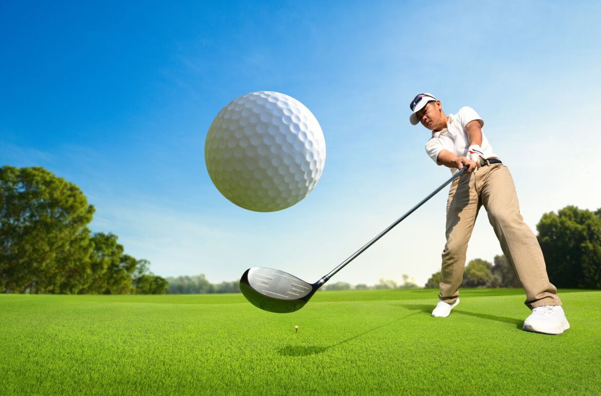 Close up of golfer hitting the ball on golf course