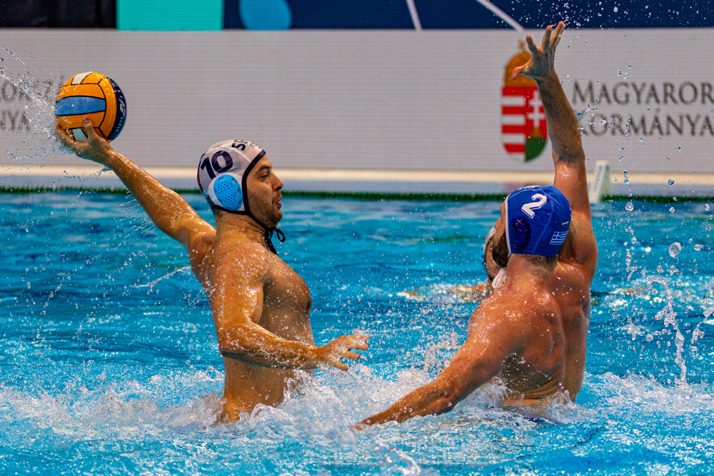 Water polo two male athletes playing water polo